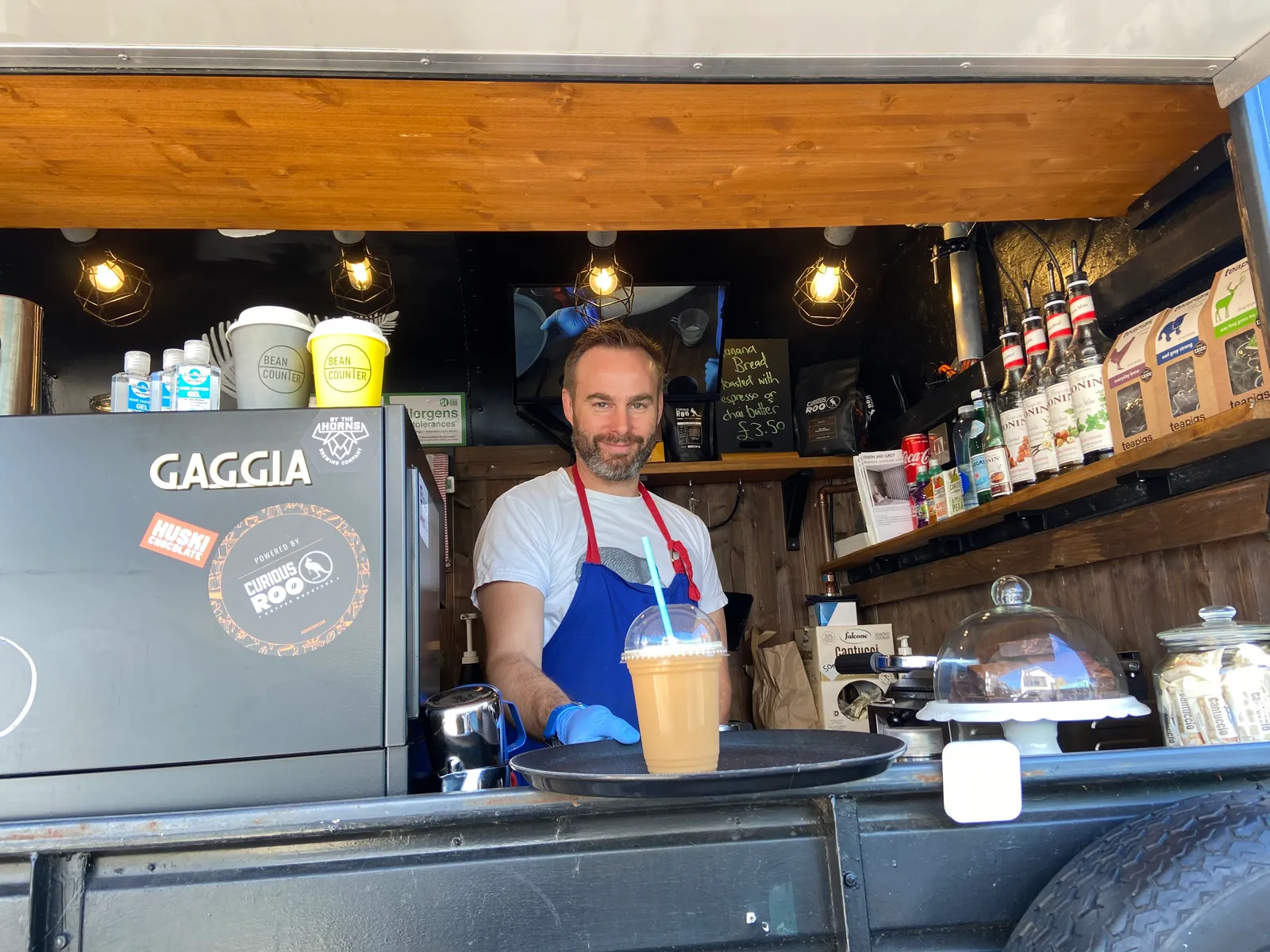 Carl serving a drink at Bean Counter
